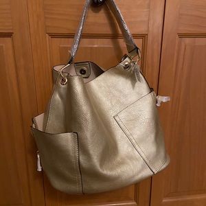 Slouchy gold handbag with removable shoulder bag